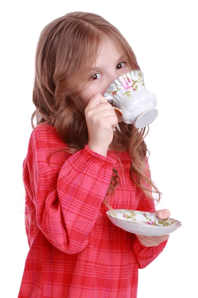 小女孩用一杯茶和酱汁 — 图库照片