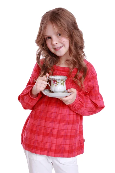 Niña con una taza de té y salsa —  Fotos de Stock