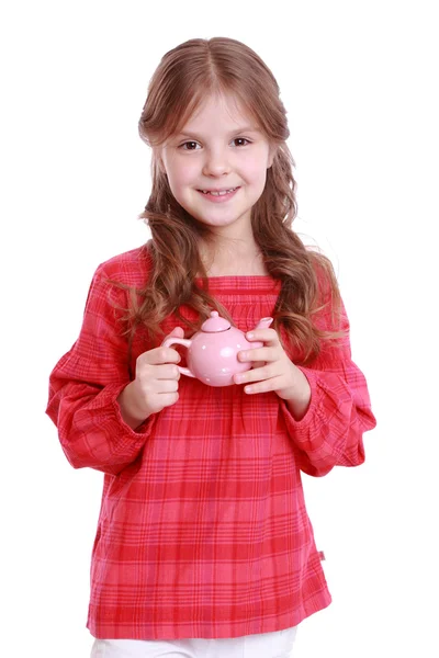 Menina brincando com pratos infantis — Fotografia de Stock