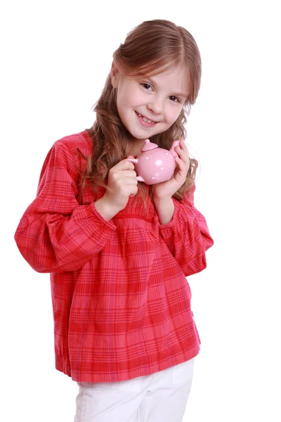 Chica jugando con platos para niños —  Fotos de Stock