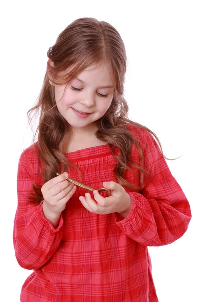 Girl holding vintage key — Stock Photo, Image