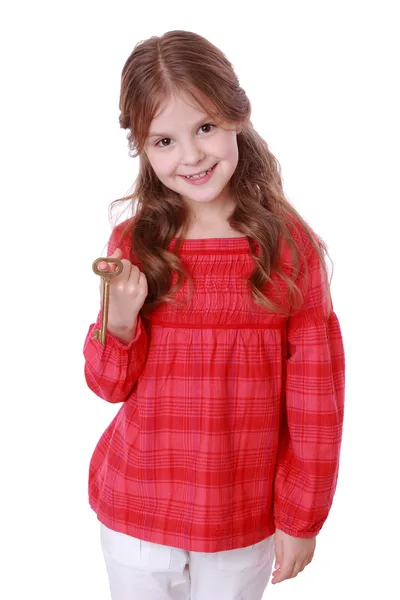 Girl holding vintage key — Stock Photo, Image