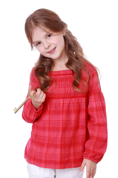 Girl holding vintage key — Stock Photo, Image