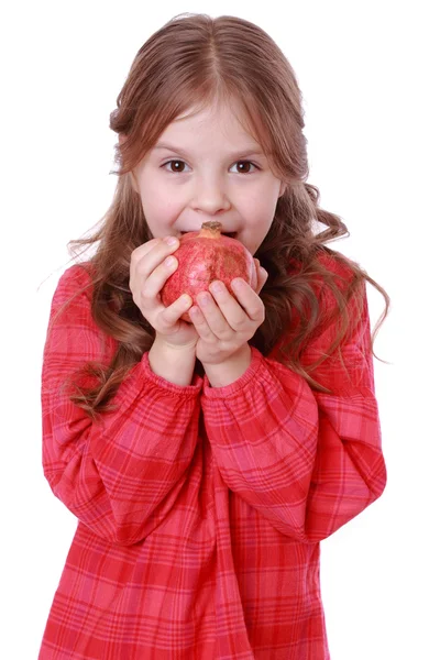 Mädchen hält Granatapfel in der Hand — Stockfoto