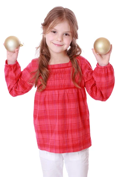 Niño sosteniendo bolas de Navidad — Foto de Stock