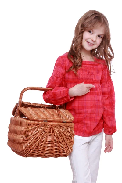 Little girl holding a picnic basket — Stock Photo, Image