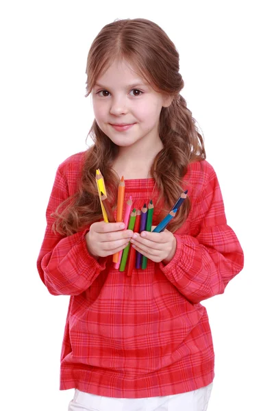 Первый класс держит цветные карандаши — стоковое фото