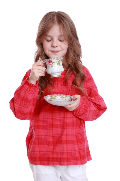 Lilla flickan dricker te — Stockfoto