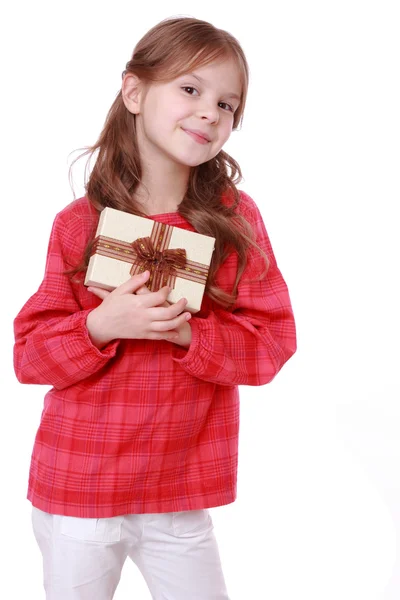 Smiling girl holding present — Stock Photo, Image