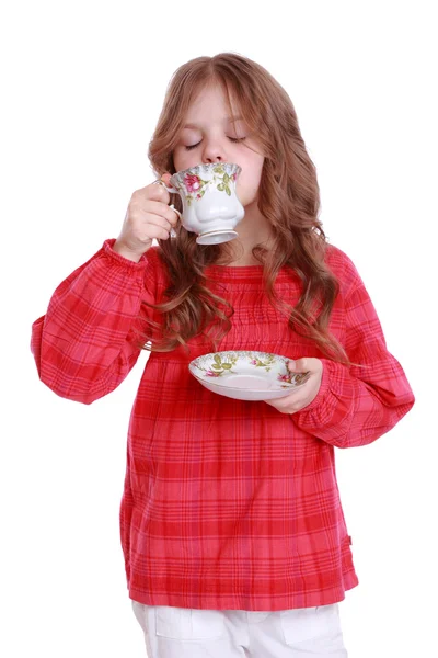 Kleines Mädchen mit einer Teetasse — Stockfoto