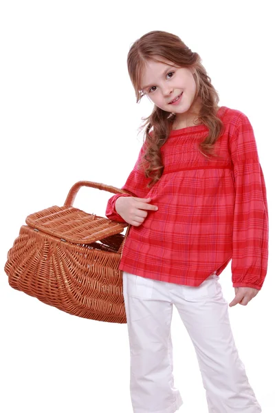 Little girl holding a picnic basket — Stock Photo, Image