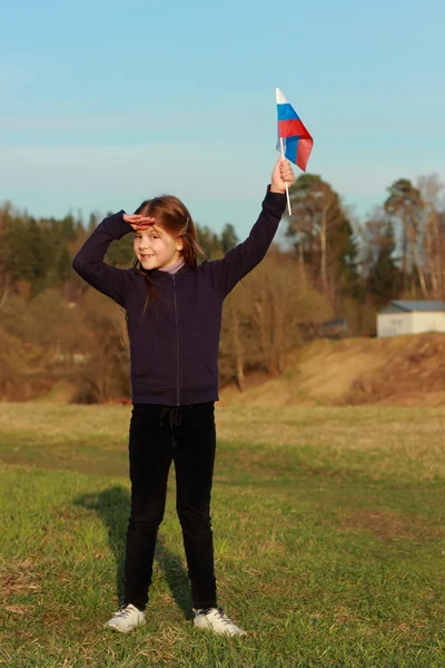 Patriotic little girl holding Russian flag — Stock Photo, Image