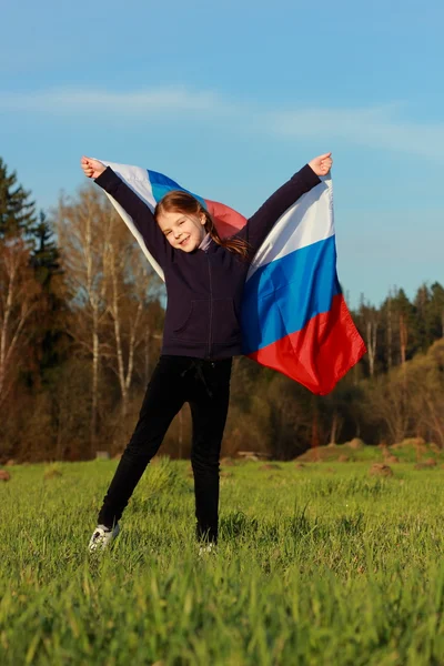 Mädchen mit einer großen russischen Flagge — Stockfoto