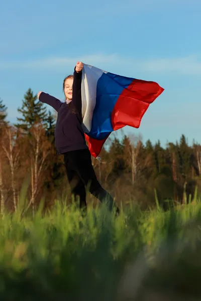 Beautiful little girl with Russian flag — Stock Photo, Image