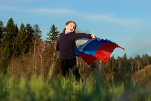 Krásná holčička s ruskou vlajkou — Stock fotografie