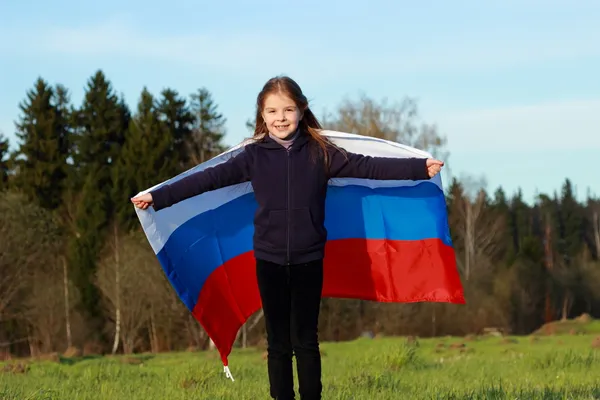 Büyük bir Rus bayrağı tutan kız — Stok fotoğraf