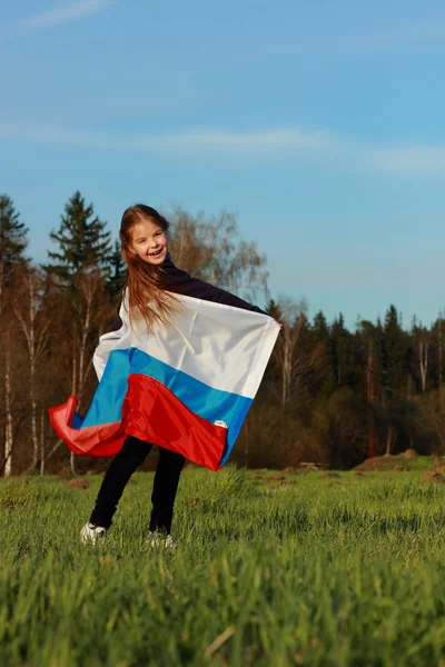 Meisje houdt een grote Russische vlag — Stockfoto