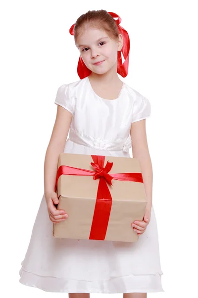 Girl holding a big gift — Stock Photo, Image