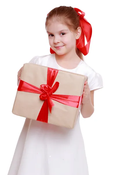 Girl holding a big gift — Stock Photo, Image