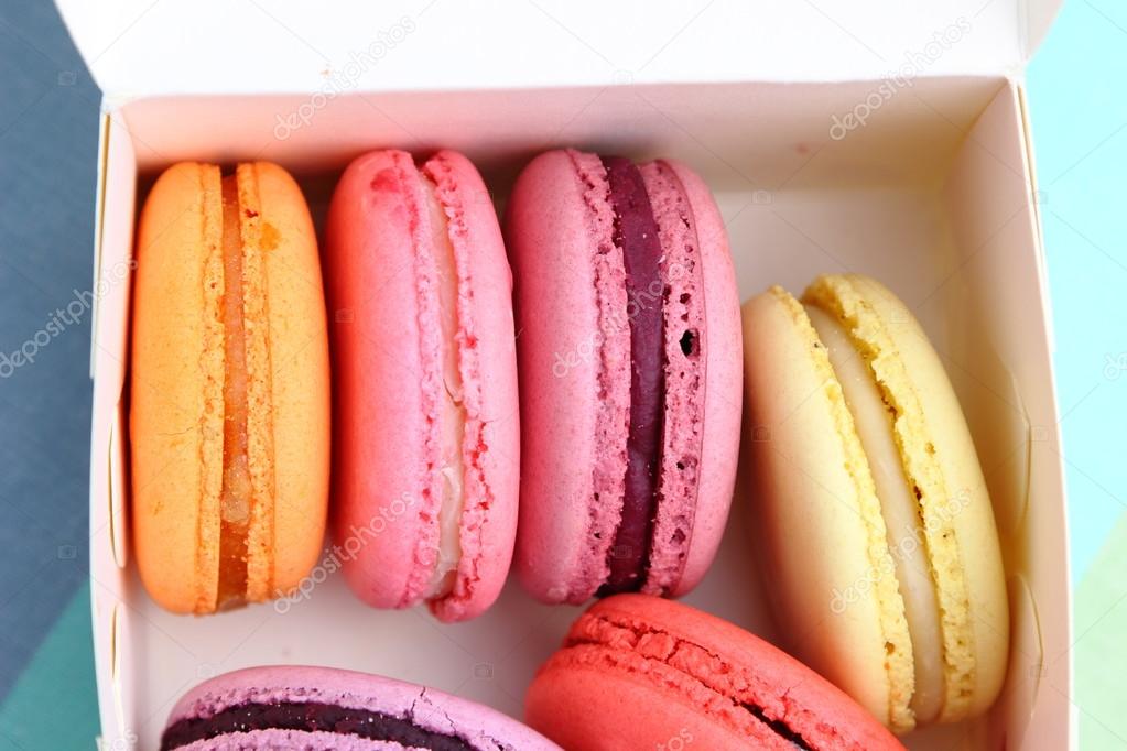 Six Tasty sweet colorful macarons in paper box