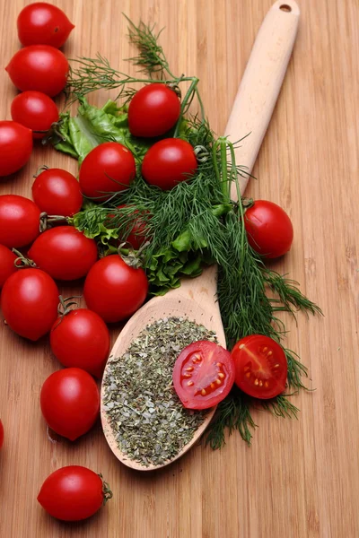 Tomatoes and herbs and spices — Stock Photo, Image