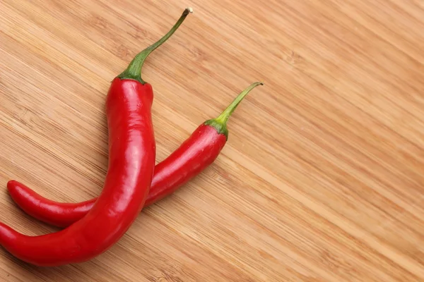 Two red chili peppers — Stockfoto