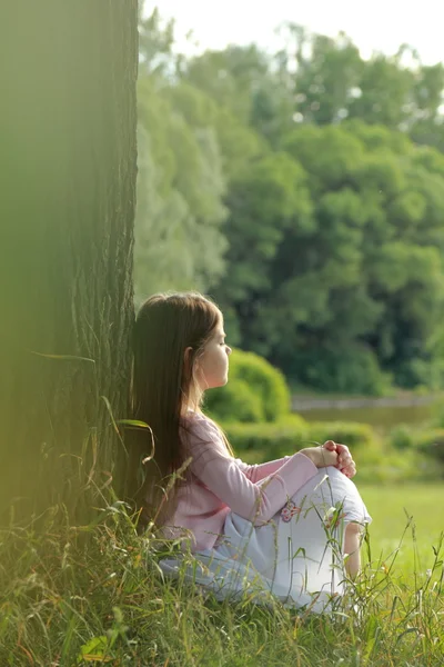 Little girl on green grass — Stock Photo, Image