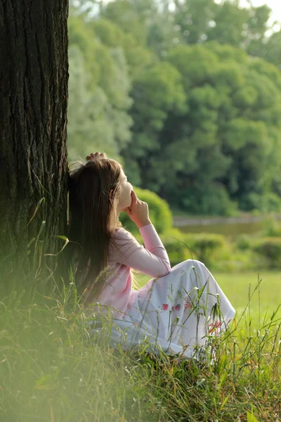 Little girl on green grass — Stock Photo, Image