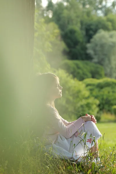 Little girl on green grass — Stock Photo, Image