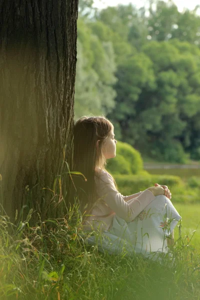 Little girl on green grass — Stock Photo, Image