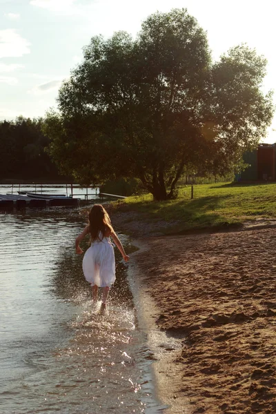 Girl running on water — Stock Photo, Image