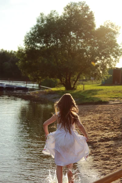 Girl running on water — Stock Photo, Image