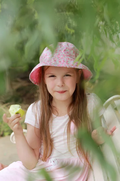 Little girl with apple — Stock Photo, Image