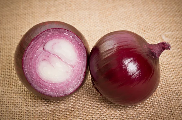 Fresh onion on sacking — Stock Photo, Image