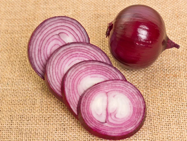 Fresh onion on sacking — Stock Photo, Image