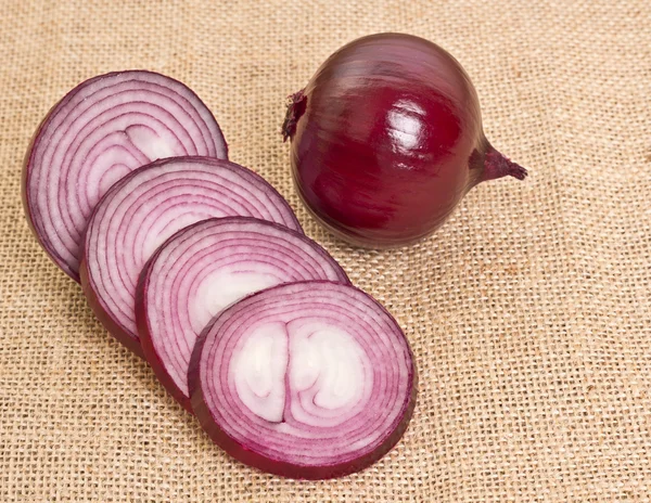 Fresh onion on sacking — Stock Photo, Image