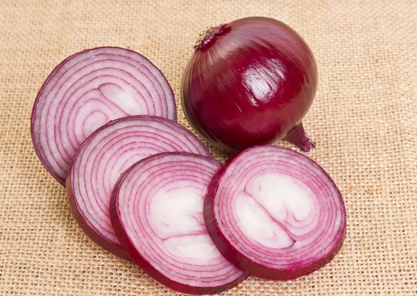 Fresh onion on sacking — Stock Photo, Image