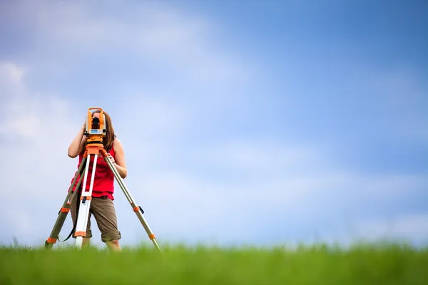 Young land surveyor at work Royalty Free Stock Photos