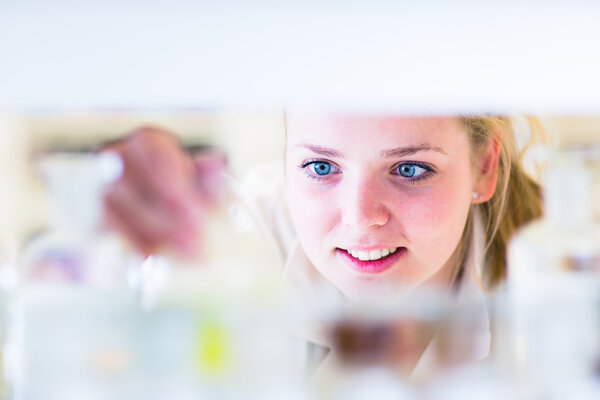Portrait of a female researcher carrying out research in a chemistry lab