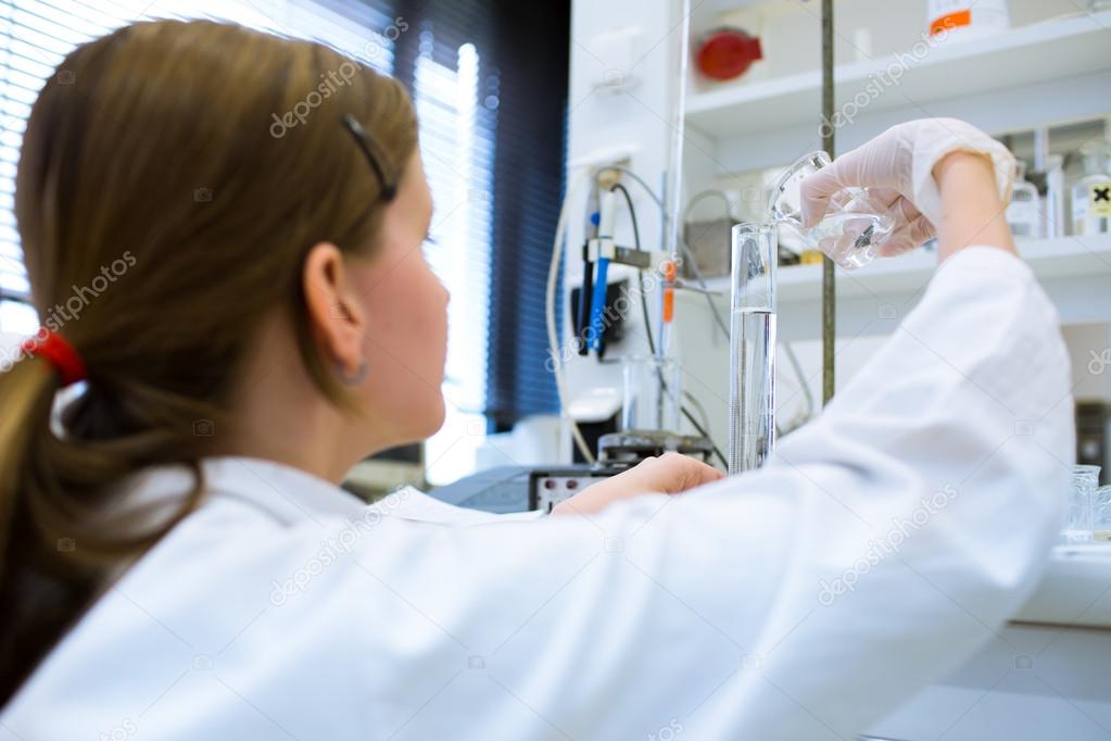 Portrait of a female researcher carrying out research in a chemistry