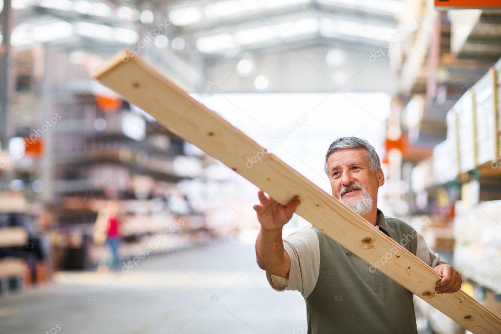 Senior man buying construction wood in a DIY store