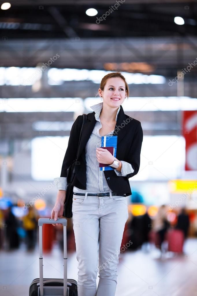 Pretty young female passenger at the airport