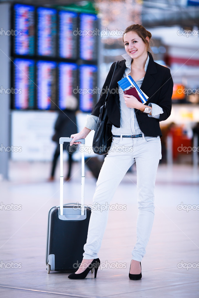 Pretty young female passenger at the airport