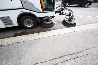 Detail of a street sweeper machine, car cleaning the road clipart