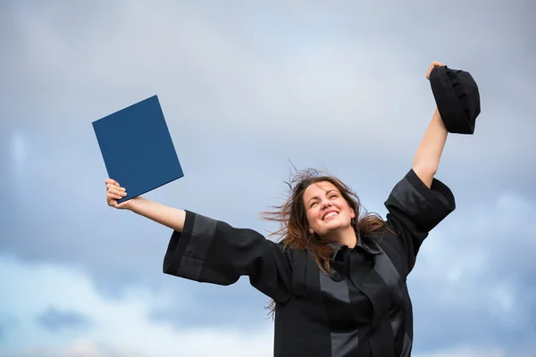 Pretty, young woman celebrating joyfully her graduation — Stock Photo, Image