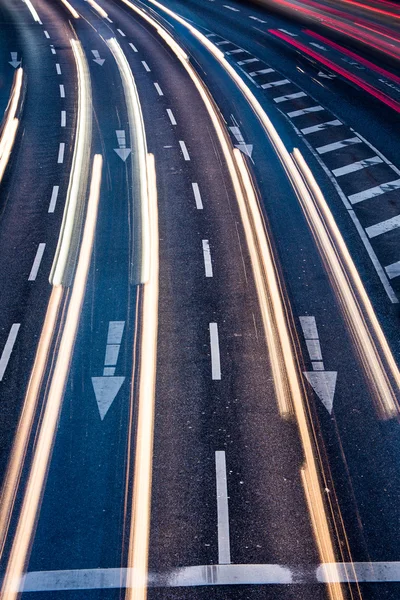 Motion blurred city road traffic (color toned  image) — Stock Photo, Image