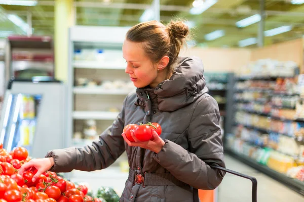 Woman shopping tomatoes Stock Photo