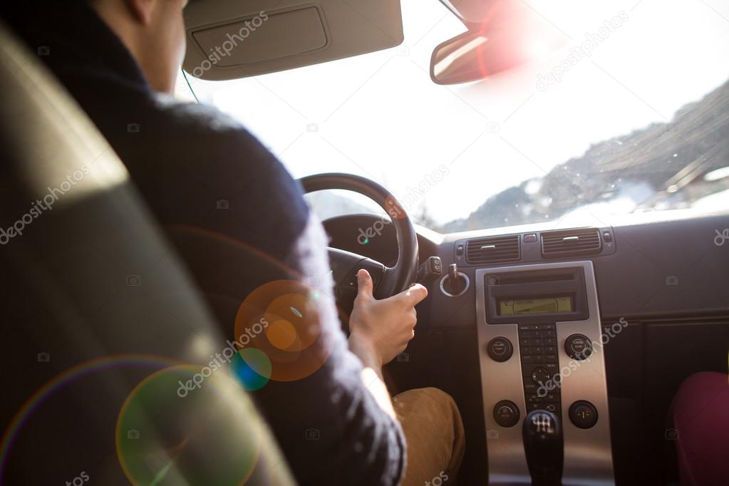 Young man driving his car