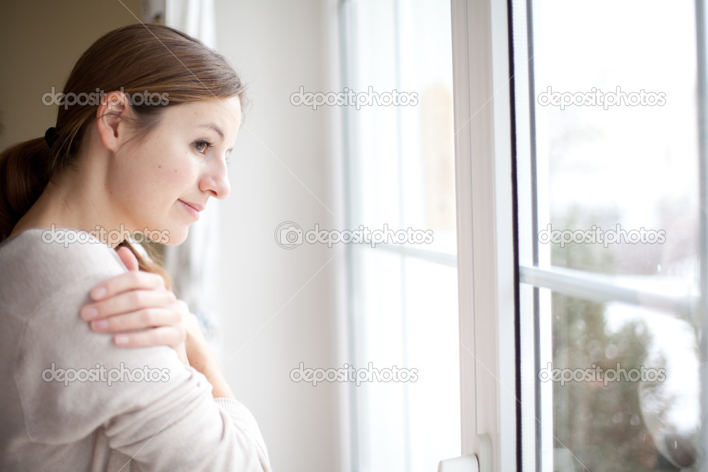 Woman looking from a window