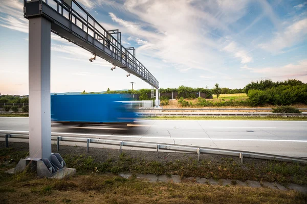 Truck passing through a toll gate — Stock Photo, Image